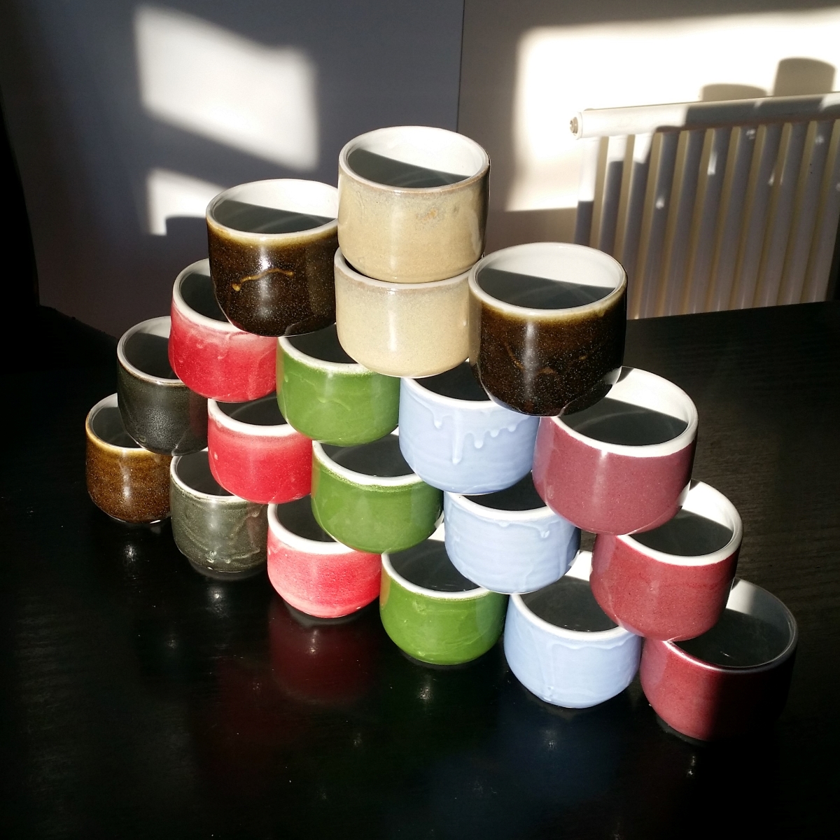 Coffee cup (no handle) in blue & green by Clifton Hill Pottery in